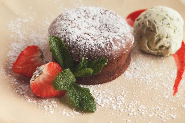 Chocolate fondant with vanilla ice cream and strawberry — Stock Photo, Image
