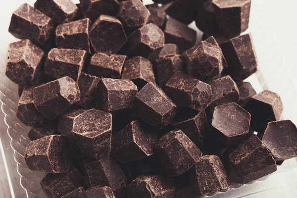 Tasty chocolate chips pile, closeup on white background — Stock Photo, Image
