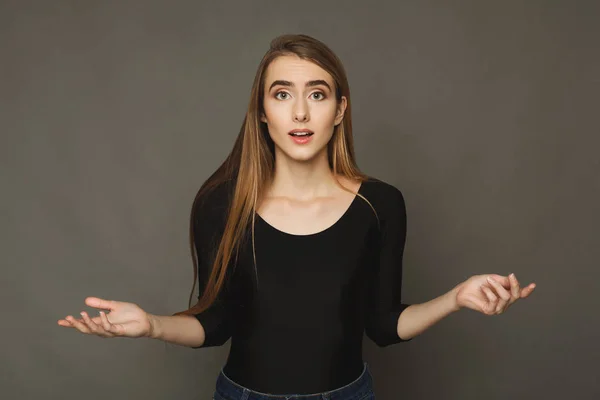 Shocked girl with arms up in air in full disbelief — Stock Photo, Image