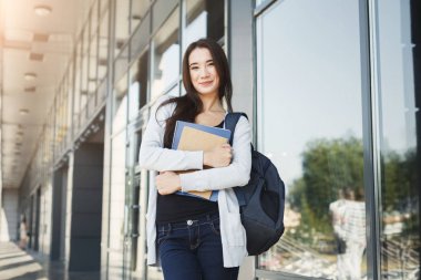 Öğrenci kız kitapları Üniversitesi arka plan ile
