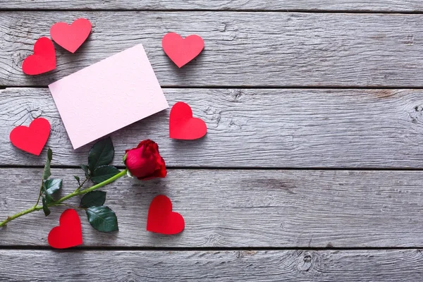 Valentine day background, hearts, card and rose flower on wood