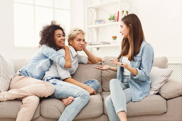 Female friends chatting at home