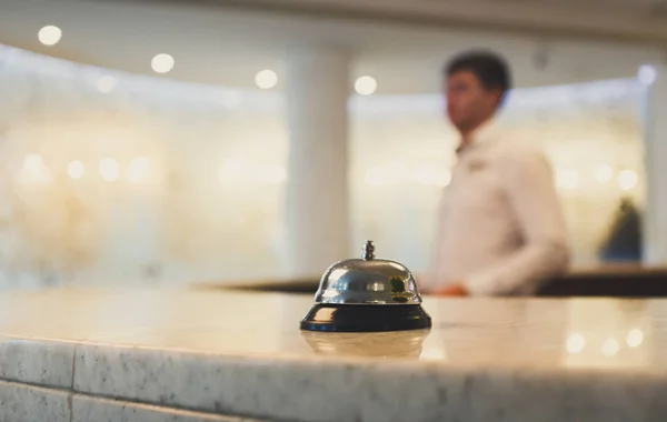 Hotel accommodation call bell on reception desk — Stock Photo, Image