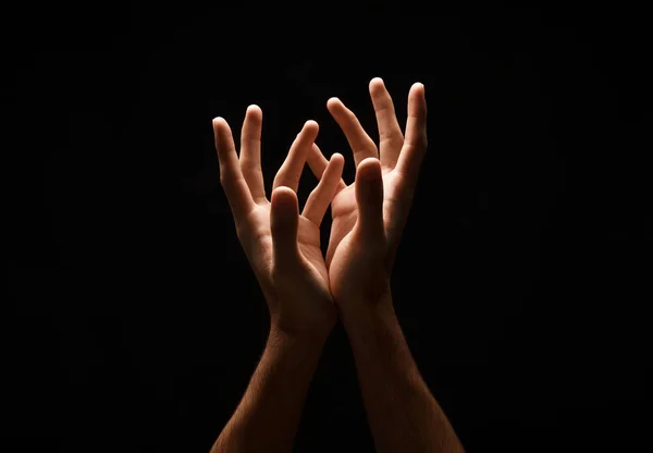 Man keeping hands in cupped shape, cutout on black — Stock Photo, Image