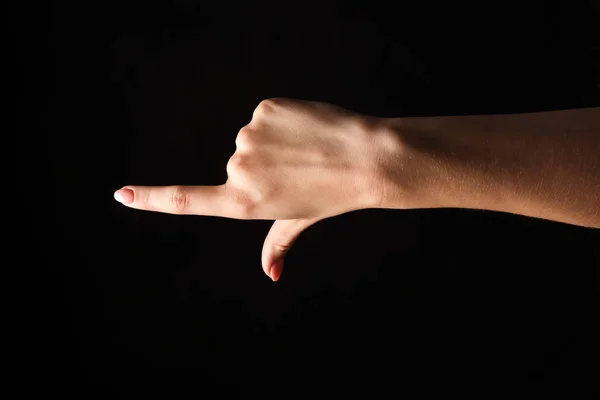手手势-女人指向, 孤立在黑色 — 图库照片