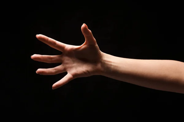 Hand isoliert auf schwarzem Hintergrund — Stockfoto