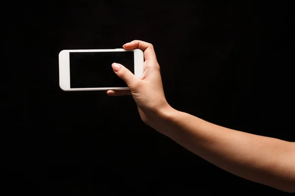 Female hand holding mobile smart phone with blank screen — Stock Photo, Image