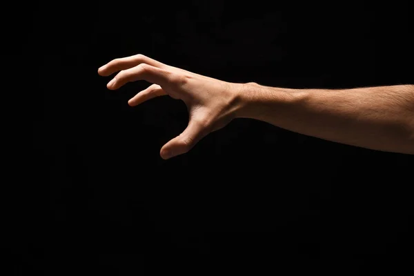 Męskiej ręki podniesienie coś, wyłącznik na czarny — Zdjęcie stockowe
