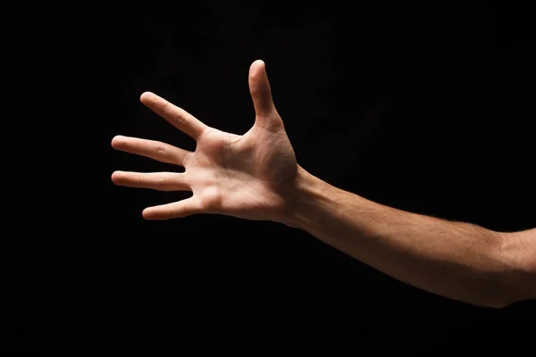 Hand isoliert auf schwarzem Hintergrund — Stockfoto