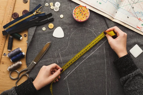 Top view on fashion designer working at messy table — Stock Photo, Image