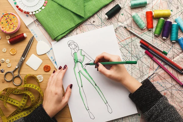 Top view on woman designer drawing clothes sketches — Stock Photo, Image