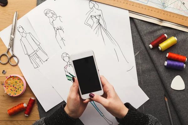 Top view on woman designer drawing clothes sketches — Stock Photo, Image