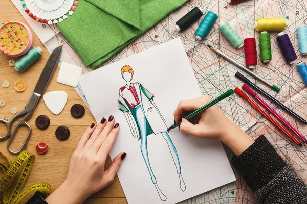 Top view on woman designer drawing clothes sketches — Stock Photo, Image