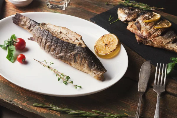 Whole grilled dorado and sea bass on table — Stock Photo, Image