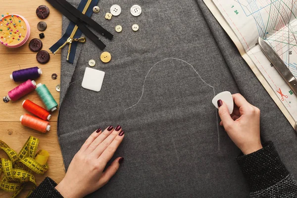 Top view on fashion designer working at messy table — Stock Photo, Image