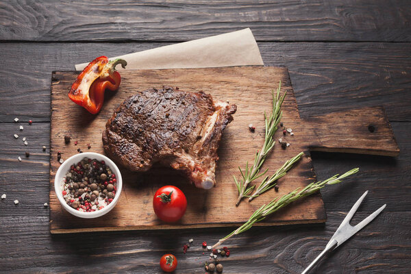 Grilled meat and vegetables on rustic wooden table