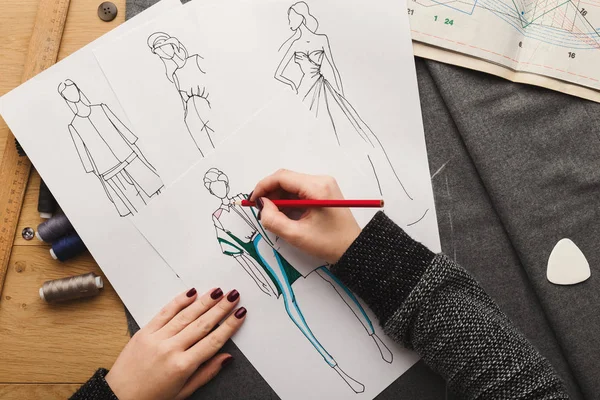 Top view on woman designer drawing clothes sketches — Stock Photo, Image