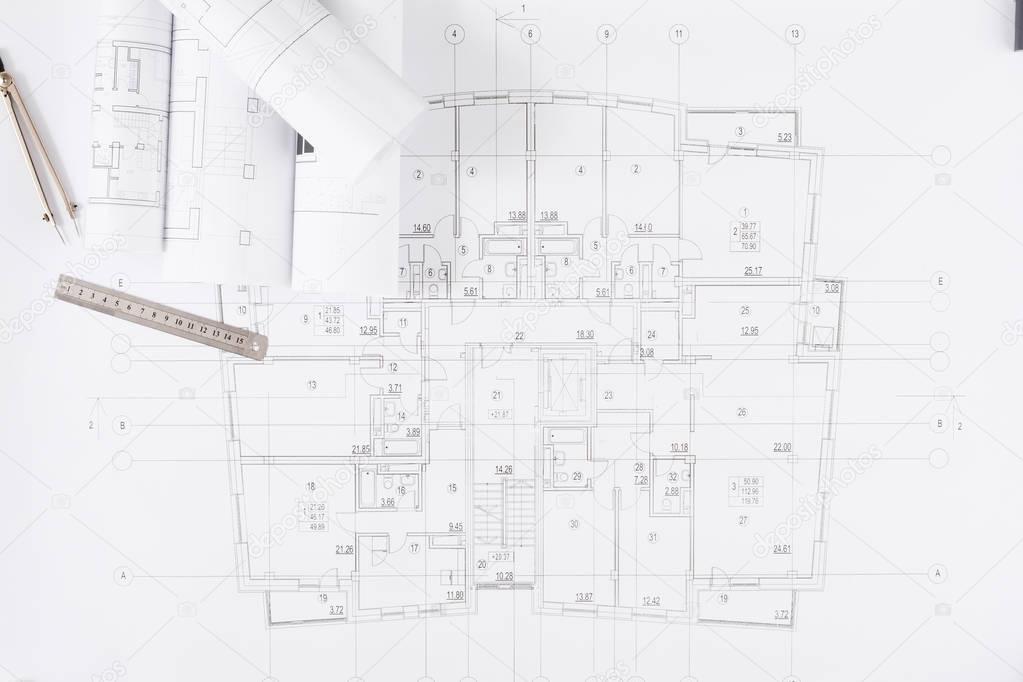 Architectural project, engineering tools on table.