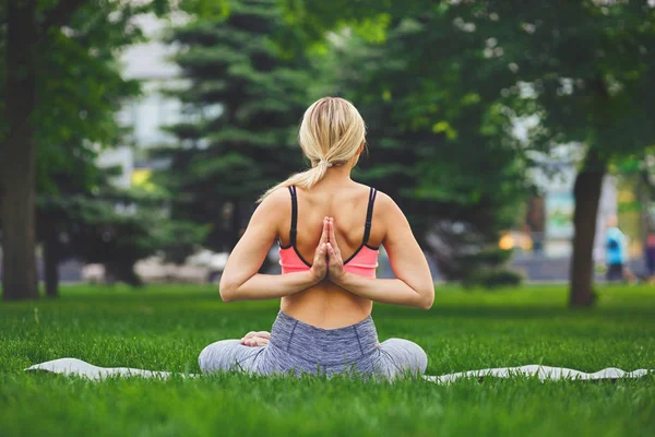 Young woman outdoors, Reverse Prayer Pose — Stock Photo, Image