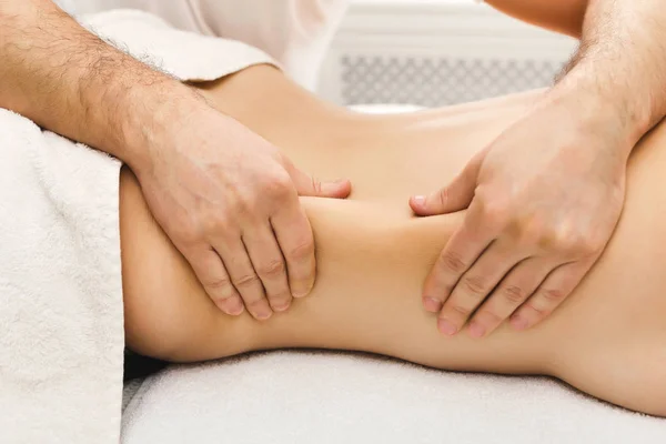 Closeup of hands massaging female shoulders and back — Stock Photo, Image