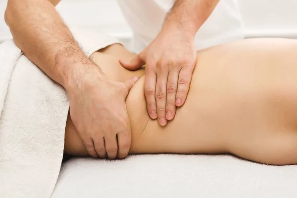 Closeup of hands massaging female shoulders and back — Stock Photo, Image