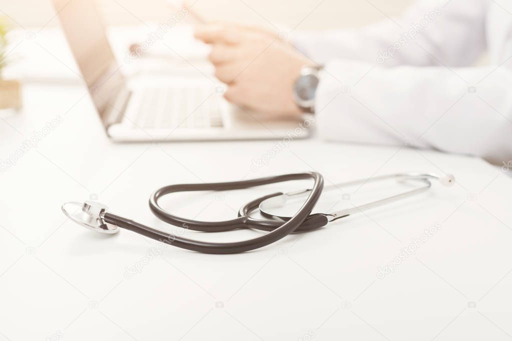 Stethoscope on prescription clipboard, selective focus