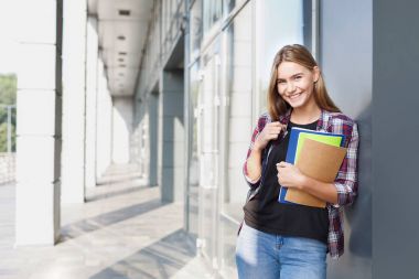 Öğrenci kız kitapları Üniversitesi arka plan ile