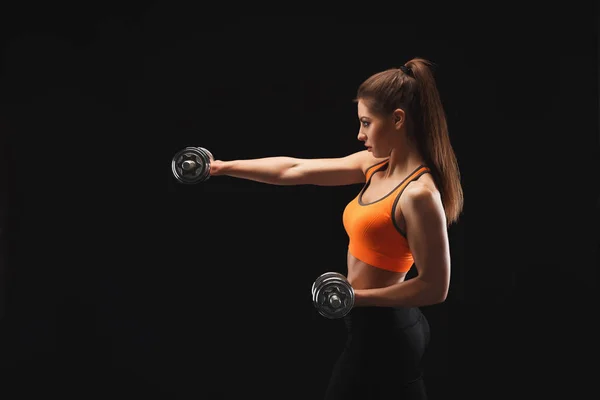 Athletic woman with dumbbells — Stock Photo, Image