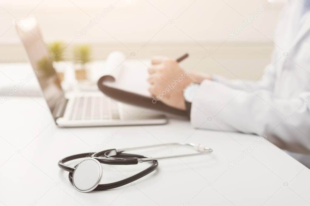 Stethoscope on the desk, selective focus