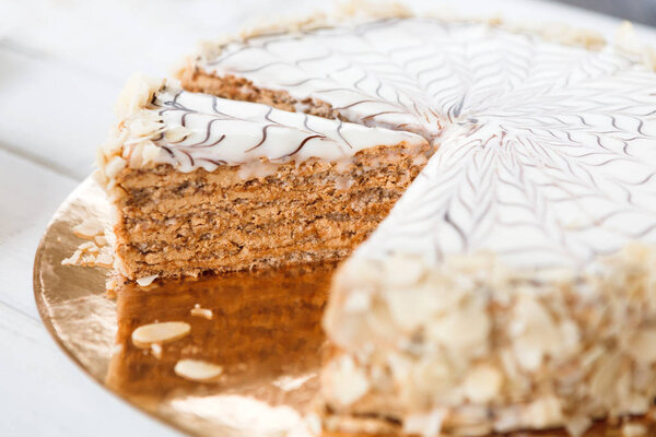 Esterhazy cake sliced on white plate closeup
