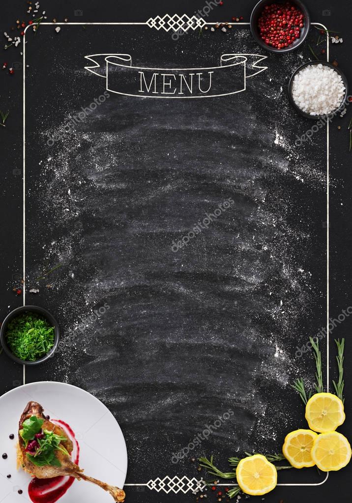 Design concept for restaurant menu mockup. Black rustic chalkboard with white inscription and vegetables frame, top view, copy space for text and logo