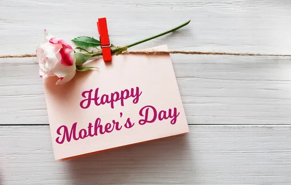 Mothers day background, card and rose flower on white wood — Stock Photo, Image