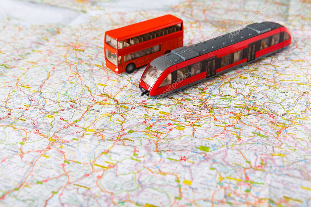 Travelling abroad background. Bus and train on the map