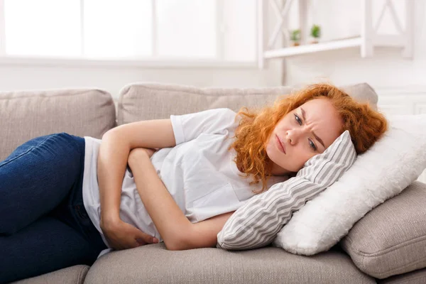 Redhead girl feeling stomachache — Stock Photo, Image