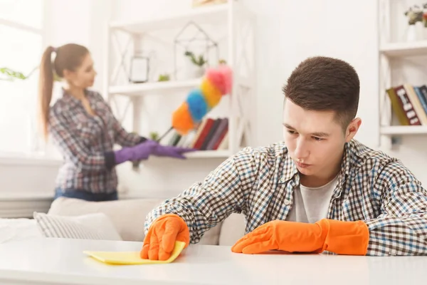 Young couple wiping dust together — Stock Photo, Image