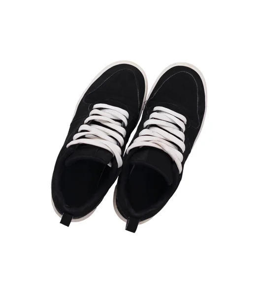 Ovanifrån av ett par svarta sneakers skor — Stockfoto