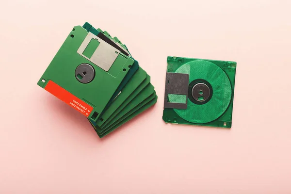 Retro floppy disks isolated on pink background