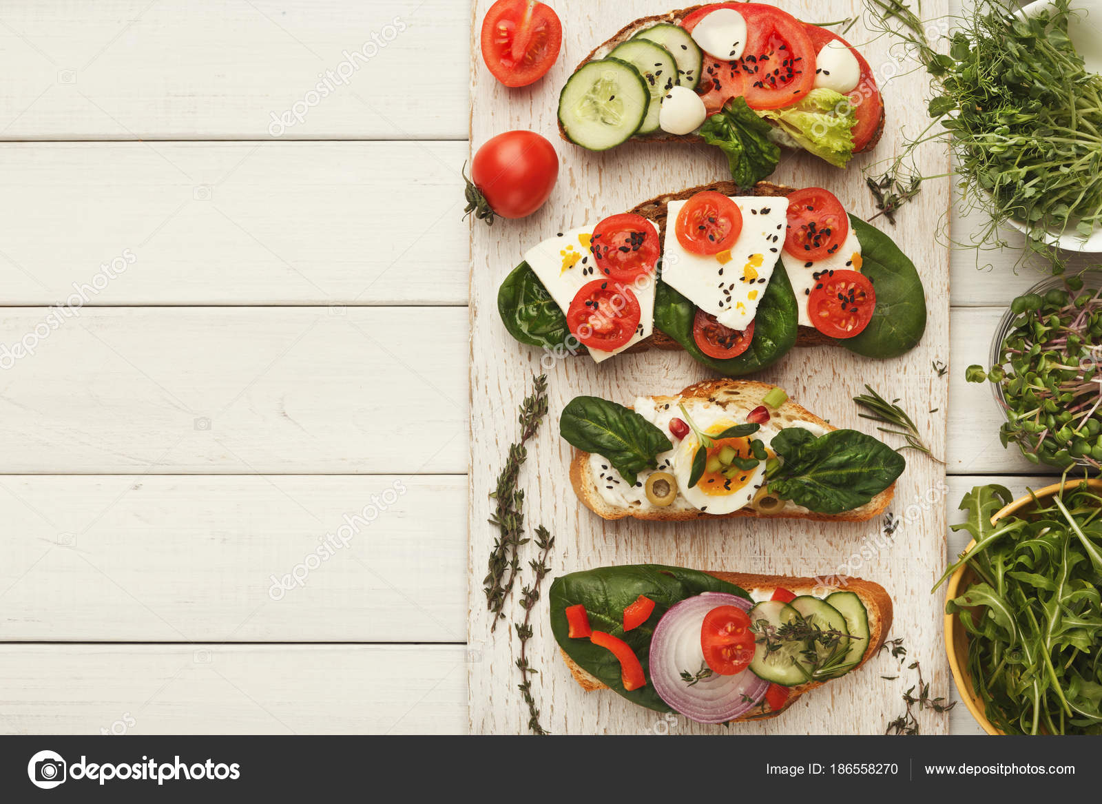 Variety of healthy vegetarian sandwiches — Stock Photo © Milkos #186558270