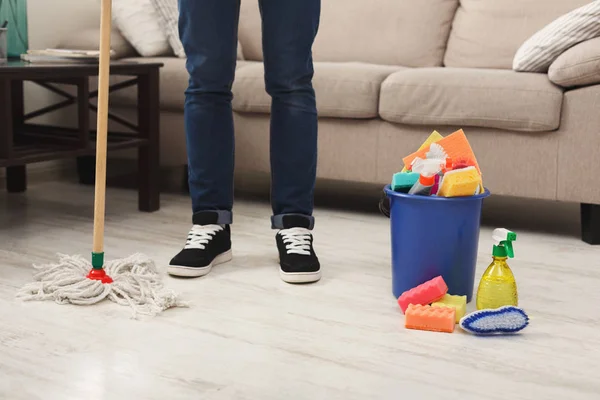 Unrecognizable man cleaning at home