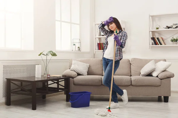 Young woman tired of spring cleaning house — Stock Photo, Image