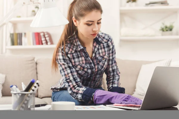 Woman cleaning laptop keyboard copy space