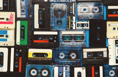 Vintage audio cassettes blue background clipart