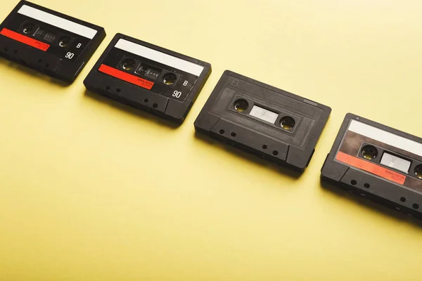 Creative background with audio cassettes of different colors — Stock Photo, Image