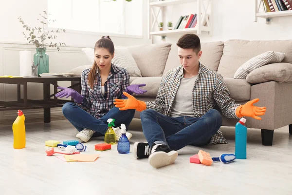 Couple cleaning at home together