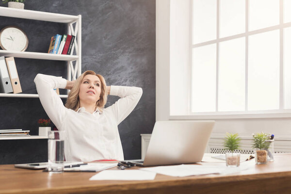 Businesswoman relaxing during office break