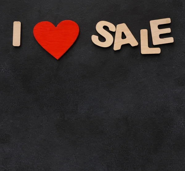 Frasa I love sales on black background with copy space — Stok Foto