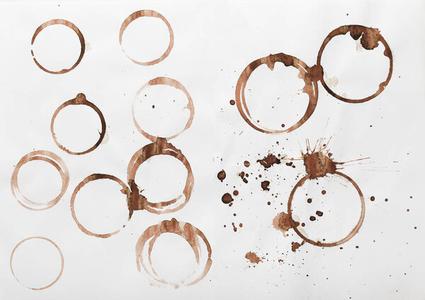 Collection of dry coffee cup stains on white background