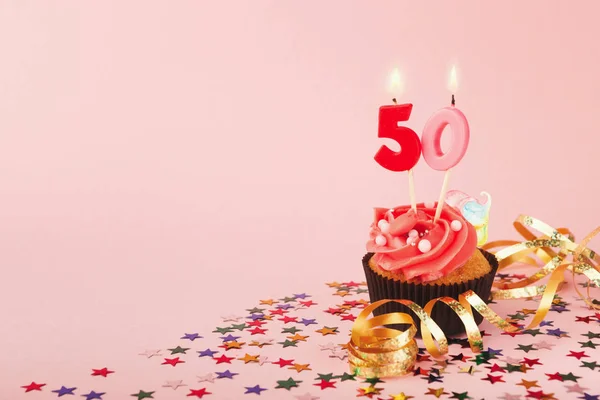 50th birthday cupcake with candle and sprinkles — Stock Photo, Image