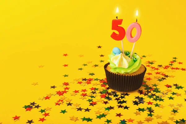 50th birthday cupcake with candle and sprinkles — Stock Photo, Image