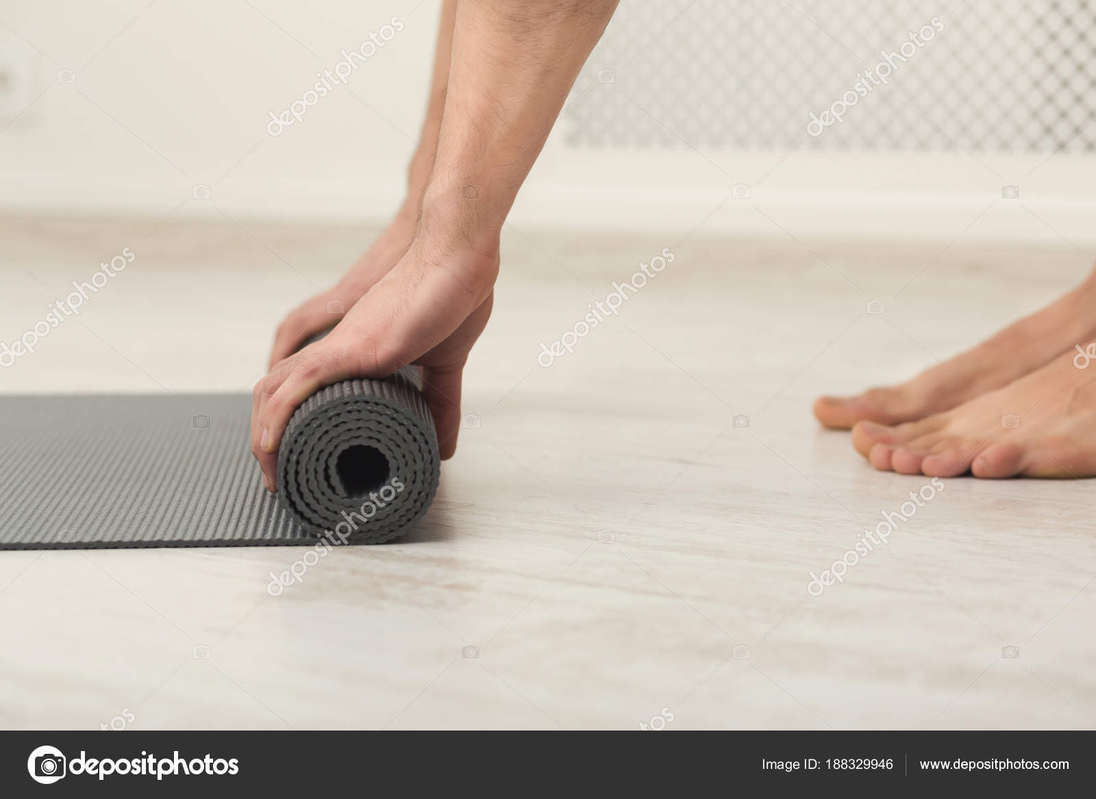 Rolling Up Fitness Mat For Exercise Copy Space Stock Photo